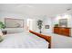 Bright main bedroom with white walls, white comforter, a ceiling fan, and natural lighting at 2514 E Montebello Ave, Phoenix, AZ 85016