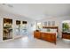 Main bedroom features a wood bed frame, white walls, a ceiling fan, and patio access at 2514 E Montebello Ave, Phoenix, AZ 85016