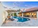 Inviting pool area, beautiful travertine deck, lounge chairs and tables, perfect for poolside enjoyment at 2514 E Montebello Ave, Phoenix, AZ 85016