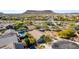 Aerial view of a home with a backyard pool and mountain views in a desert community at 2525 E Misty Willow Ln, Phoenix, AZ 85024