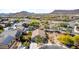 A high angle view shows a house with a pool, solar panels and desert landscaping at 2525 E Misty Willow Ln, Phoenix, AZ 85024