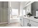 Bright bathroom featuring double sinks, a soaking tub with glass block window, and a separate shower at 2525 E Misty Willow Ln, Phoenix, AZ 85024