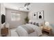 Comfortable bedroom featuring neutral tones, a ceiling fan, and stylish decor for a relaxing atmosphere at 2525 E Misty Willow Ln, Phoenix, AZ 85024