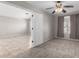 Cozy bedroom with a ceiling fan, carpet and view into a large tiled living space at 2525 E Misty Willow Ln, Phoenix, AZ 85024