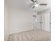 An ample bedroom featuring neutral carpet, a ceiling fan, and closet with sliding doors at 2525 E Misty Willow Ln, Phoenix, AZ 85024