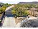 Charming single-story home featuring desert landscaping, long driveway, and mountain views at 2525 E Misty Willow Ln, Phoenix, AZ 85024