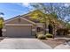 Charming single-story home with a two-car garage and well-maintained landscaping at 2525 E Misty Willow Ln, Phoenix, AZ 85024