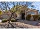 Charming single-story home with desert landscaping, a covered entryway, and a two-car garage at 2525 E Misty Willow Ln, Phoenix, AZ 85024