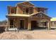 Exterior view of a two story home under construction framing completed at 25678 N Boreas Rd, Florence, AZ 85132