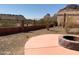 Desert landscaped backyard featuring a stone fire pit with mountain views at 27575 N Dolores Pl, San Tan Valley, AZ 85144