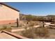 Desert landscape backyard with fire pit and native cacti at 27575 N Dolores Pl, San Tan Valley, AZ 85144