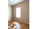 Bedroom with wood floors, a window letting in light, and neutral-toned walls at 27575 N Dolores Pl, San Tan Valley, AZ 85144