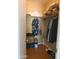 Walk-in closet with shelving, hanging clothes, and assorted items on the floor at 27575 N Dolores Pl, San Tan Valley, AZ 85144