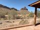 Desert view from porch features mountains and sparse vegetation at 27575 N Dolores Pl, San Tan Valley, AZ 85144