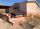 Exterior view of stucco home with covered hot tub and desert landscaping at 27575 N Dolores Pl, San Tan Valley, AZ 85144