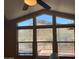 Stunning mountain view framed by the living room windows at 27575 N Dolores Pl, San Tan Valley, AZ 85144