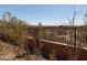 View of neighborhood and desert landscape from backyard with rod iron fence at 27575 N Dolores Pl, San Tan Valley, AZ 85144