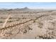 Expansive aerial view of a desert landscape showcasing a vast expanse and distant mountain views at 27864 N 158Th Ave, Surprise, AZ 85387