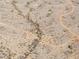 An aerial view of a desert with sparse vegetation and dry creekbeds running through it at 27864 N 158Th Ave, Surprise, AZ 85387