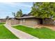 Exterior view showcasing well-maintained landscaping around the side of the home at 286 W Palomino Dr # 101, Chandler, AZ 85225