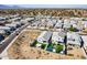 Overhead aerial view of homes with lush backyard amenities, well-kept turf, and modern landscaping in a desert setting at 3029 S 78Th Dr, Phoenix, AZ 85043