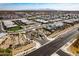 Wide aerial shot showcasing a Primary-planned community with palm tree-lined streets and desert landscaping under a bright sky at 3029 S 78Th Dr, Phoenix, AZ 85043