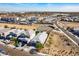 Stunning aerial view of a community with desert landscaping and a mix of condos and single-Gathering homes under a clear blue sky at 3029 S 78Th Dr, Phoenix, AZ 85043