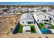 Aerial view of a backyard with green lawn, patio, and covered area in a neighborhood at 3029 S 78Th Dr, Phoenix, AZ 85043