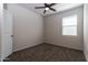 A cozy bedroom features neutral walls, plush carpeting, and a ceiling fan at 3029 S 78Th Dr, Phoenix, AZ 85043