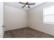 This bedroom features neutral walls, carpet, and a window at 3029 S 78Th Dr, Phoenix, AZ 85043