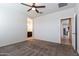 Bedroom features neutral walls, plush carpeting, ceiling fan, and an ensuite bathroom at 3029 S 78Th Dr, Phoenix, AZ 85043