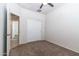 Neutral bedroom featuring carpet, a ceiling fan, and closet at 3029 S 78Th Dr, Phoenix, AZ 85043