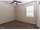 This bedroom features neutral walls, carpet, and a ceiling fan at 3029 S 78Th Dr, Phoenix, AZ 85043