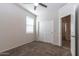 This bedroom features neutral walls, carpet, and a ceiling fan at 3029 S 78Th Dr, Phoenix, AZ 85043