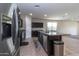 Bright kitchen with stainless steel appliances and granite countertops at 3029 S 78Th Dr, Phoenix, AZ 85043