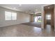 Open living room showcasing tile flooring and sliding glass doors to the backyard at 3029 S 78Th Dr, Phoenix, AZ 85043