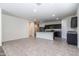 Open floor plan featuring living room with tile flooring leading into the kitchen at 3029 S 78Th Dr, Phoenix, AZ 85043