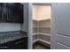 Walk-in pantry featuring built-in shelving at 3029 S 78Th Dr, Phoenix, AZ 85043