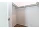 Bright walk-in closet offers ample storage space with rods and shelving at 3029 S 78Th Dr, Phoenix, AZ 85043