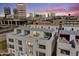 Stunning aerial view of modern condos at dusk, with a beautiful city skyline in the background at 312 E Windsor Ave # 2, Phoenix, AZ 85004