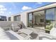 Outdoor patio area featuring modern white patio furniture with sliding door access to the interior at 312 E Windsor Ave # 2, Phoenix, AZ 85004