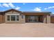 Spacious backyard featuring a covered patio and ample space for outdoor activities and landscaping at 32489 N 135Th Dr, Peoria, AZ 85383