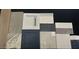 Selection of interior design materials showing different shades of carpet, paint, tile, and counter samples at 32489 N 135Th Dr, Peoria, AZ 85383