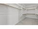 Spacious walk-in closet with custom shelving and ample storage, ready for organization at 32489 N 135Th Dr, Peoria, AZ 85383