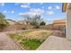 Backyard featuring a patio, block fence, and potential for landscaping at 330 E Cheyenne Rd, San Tan Valley, AZ 85143