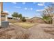 Backyard featuring a gravel area, block fence, and potential for landscaping at 330 E Cheyenne Rd, San Tan Valley, AZ 85143