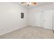 Neutral bedroom featuring plush carpet, white walls, and closet with doors at 330 E Cheyenne Rd, San Tan Valley, AZ 85143