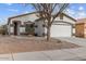 Charming single-story home features a two-car garage and low maintenance desert landscaping at 330 E Cheyenne Rd, San Tan Valley, AZ 85143