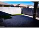 Backyard featuring artificial grass with a block wall and patio at 3648 E Perkinsvile St, Gilbert, AZ 85295