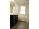 Bathroom featuring a soaking tub, double sink, and a glass-enclosed shower at 3648 E Perkinsvile St, Gilbert, AZ 85295